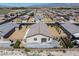 Aerial view of the backyard featuring desert landscape, metal fencing, and a patio at 3543 E Wallowa Dr, Pahrump, NV 89061