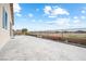 Expansive back patio featuring stamped concrete, flower beds, desert landscape, and wrought iron perimeter fencing at 3543 E Wallowa Dr, Pahrump, NV 89061