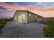 Backyard patio featuring concrete pavers, desert landscape, and a covered patio at 3543 E Wallowa Dr, Pahrump, NV 89061