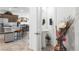 View from a hallway of the eat-in kitchen island and of the half bathroom with modern vanity and fixtures at 3543 E Wallowa Dr, Pahrump, NV 89061