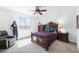 Spacious bedroom featuring a ceiling fan and a large window with mountain views at 3543 E Wallowa Dr, Pahrump, NV 89061