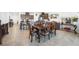 Elegant dining room with a large table, dark cabinets, and access to the kitchen at 3543 E Wallowa Dr, Pahrump, NV 89061