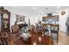 Beautiful dining room table with view of the kitchen with granite counters and brown cabinets at 3543 E Wallowa Dr, Pahrump, NV 89061