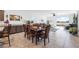 Dining area with a dark wood dining table and chairs, and a view of the backyard at 3543 E Wallowa Dr, Pahrump, NV 89061