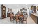 Traditional dining room featuring a classic wooden dining table and chairs next to an elaborate grandfather clock at 3543 E Wallowa Dr, Pahrump, NV 89061