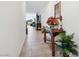 Long hallway featuring tile floors, decorative table, and partial view of the living room at 3543 E Wallowa Dr, Pahrump, NV 89061