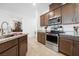 Modern kitchen features granite counters, stainless appliances, and a large island with a sink at 3543 E Wallowa Dr, Pahrump, NV 89061