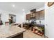 Kitchen features stainless steel oven and microwave along with dark brown cabinets and granite countertops at 3543 E Wallowa Dr, Pahrump, NV 89061