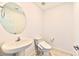 Small bathroom with pedestal sink and bidet toilet at 3634 Tripoli Cove Ave, Las Vegas, NV 89106