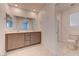 Bathroom features double sink vanity, large mirror, and a separate toilet room with a shower at 3634 Tripoli Cove Ave, Las Vegas, NV 89106