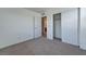 Bright bedroom features neutral carpet, white walls, and large closet with sliding doors at 3634 Tripoli Cove Ave, Las Vegas, NV 89106