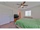 Spacious bedroom with ceiling fan, large window, and ample closet space at 3634 Tripoli Cove Ave, Las Vegas, NV 89106