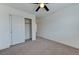 Bright bedroom featuring carpet flooring, white walls, and a closet with sliding doors at 3634 Tripoli Cove Ave, Las Vegas, NV 89106