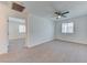 Bedroom with carpet flooring, a ceiling fan, and a large window at 3634 Tripoli Cove Ave, Las Vegas, NV 89106