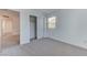 Bright bedroom featuring carpet flooring, white walls, a window, and a closet with sliding doors at 3634 Tripoli Cove Ave, Las Vegas, NV 89106