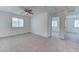 Bedroom with carpet flooring, a ceiling fan, and a large window at 3634 Tripoli Cove Ave, Las Vegas, NV 89106