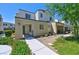 Two-story townhome with modern facade and landscaped walkway at 3634 Tripoli Cove Ave, Las Vegas, NV 89106