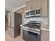 Modern kitchen features stainless steel appliances and ample cabinetry at 3634 Tripoli Cove Ave, Las Vegas, NV 89106