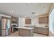 Modern kitchen with stainless steel appliances and island at 3634 Tripoli Cove Ave, Las Vegas, NV 89106