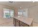 Close-up on a kitchen island with cabinets, drawers, and quartz countertop at 3634 Tripoli Cove Ave, Las Vegas, NV 89106