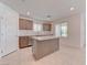 Kitchen featuring stainless steel appliances, an island, and tile flooring at 3634 Tripoli Cove Ave, Las Vegas, NV 89106