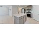 Kitchen featuring stainless steel appliances, an island, and granite countertops at 3634 Tripoli Cove Ave, Las Vegas, NV 89106
