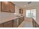 Clean kitchen with stainless steel dishwasher and white countertops at 3634 Tripoli Cove Ave, Las Vegas, NV 89106