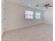Living room area with tile flooring, a ceiling fan, and neutral walls at 3634 Tripoli Cove Ave, Las Vegas, NV 89106