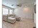 Spacious living room with tiled floors and ceiling fan at 3634 Tripoli Cove Ave, Las Vegas, NV 89106