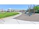 Community playground with play structures and open green space at 3634 Tripoli Cove Ave, Las Vegas, NV 89106