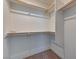 This walk-in closet includes shelving on three sides and carpeted floors at 3634 Tripoli Cove Ave, Las Vegas, NV 89106