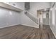 Living room with a white staircase and wood flooring at 3950 S Sandhill Rd # 112, Las Vegas, NV 89121