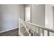 A bright stairway with white banisters and wood floors at 3950 S Sandhill Rd # 112, Las Vegas, NV 89121