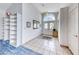 Bright foyer with tile flooring, a large arched window, and open access to other rooms at 4320 Flagship Ct, Las Vegas, NV 89121