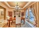 Dining room features a decorative chandelier and natural lighting at 453 Via Palermo Dr, Henderson, NV 89011