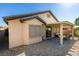 Exterior view of the home's backyard featuring a covered patio area, desert landscaping and a low-maintenance yard at 5805 Hannah Brook St, North Las Vegas, NV 89081