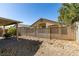 Fenced backyard with desert landscaping, patio area, and low-maintenance features at 5805 Hannah Brook St, North Las Vegas, NV 89081