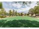 Outdoor basketball court surrounded by benches, trees and manicured landscaping, offering recreational opportunities at 5805 Hannah Brook St, North Las Vegas, NV 89081