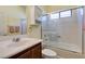 Well-lit bathroom with a single sink vanity, toilet, and shower over tub at 5805 Hannah Brook St, North Las Vegas, NV 89081