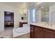 Primary bathroom featuring dual vanities, a soaking tub, and a separate shower at 5805 Hannah Brook St, North Las Vegas, NV 89081