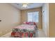 Cozy bedroom featuring a patterned bedspread, ceiling fan, and neutral walls at 5805 Hannah Brook St, North Las Vegas, NV 89081
