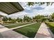 Well-maintained bocce ball courts surrounded by lush greenery, offering a recreational amenity at 5805 Hannah Brook St, North Las Vegas, NV 89081