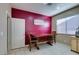 Bright dining area with a wood table, two chairs, and an accent wall at 5805 Hannah Brook St, North Las Vegas, NV 89081