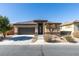 Charming single-story home featuring a well-manicured front yard and a two-car garage at 5805 Hannah Brook St, North Las Vegas, NV 89081