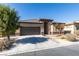 Attractive single-story home with desert landscaping, a two-car garage, and a welcoming entrance at 5805 Hannah Brook St, North Las Vegas, NV 89081