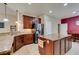 Well-equipped kitchen with granite countertops, stainless steel appliances, and a center island at 5805 Hannah Brook St, North Las Vegas, NV 89081
