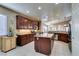Open kitchen with stainless steel appliances, granite countertops and a central island at 5805 Hannah Brook St, North Las Vegas, NV 89081