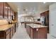 Large kitchen with stainless steel appliances, granite countertops, and island with bar seating at 5805 Hannah Brook St, North Las Vegas, NV 89081
