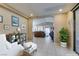 Bright living room showcasing neutral tones, tile flooring, and seamless indoor-outdoor flow at 5805 Hannah Brook St, North Las Vegas, NV 89081