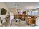 Open-concept living room with a comfortable sectional, a view into the kitchen, and a game room at 5805 Hannah Brook St, North Las Vegas, NV 89081